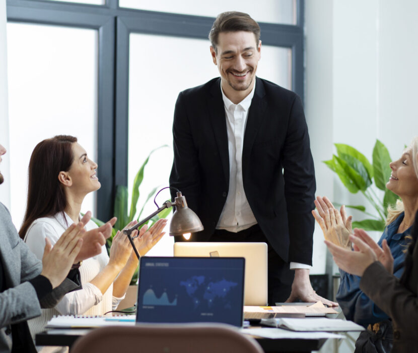 close-up-people-working-together-desk